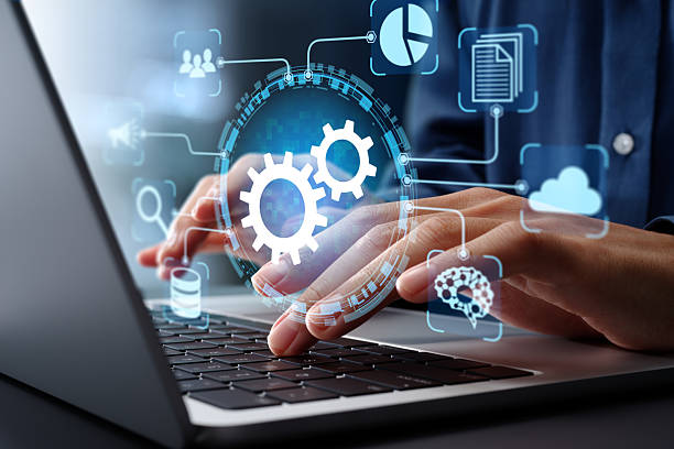 istock Business process automation BPA and robotic process automation RPA systems. API automation and data transfer with system integration. Businessman using laptop computer with intelligent automation technology. 2207584646