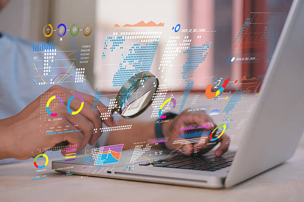 businessman holding magnifying glass looking at virtual data chart dashboard in concept of investment data analysis and DMS document audit financial Tax Fraud audit Using Magnifying Glass
