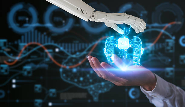 istock artificial intelligence AI tech concept, robot hand and man hand holding virtual ai icon on blurred ai technology background 2207586744