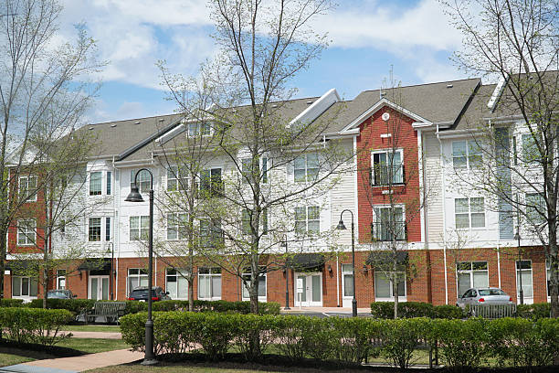 istock colorful apartment buildings and green front lawn in spring 2207588738