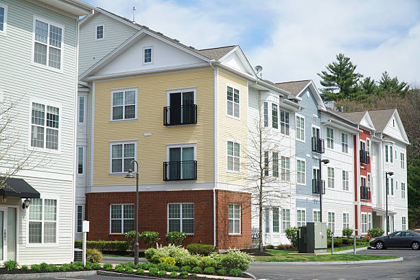 istock colorful apartment buildings and green front lawn in spring 2207588739