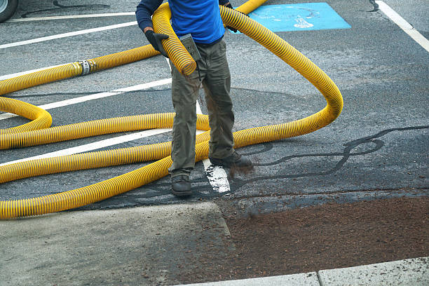 istock landscaping service worker spreading mulch in parking lot 2207589013