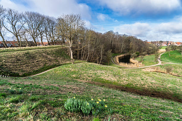 istock Curving Pathway Through Scenic Green Landscape with Trees and Blue Sky Above, Fredericia, Denmark 2207590884