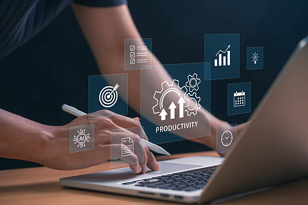 istock Boosting Productivity with AI and Automation Tools. hands using laptop with tech icons showing goals, schedules, and innovation, symbolizing data driven success and efficient workflow strategies 2207591063