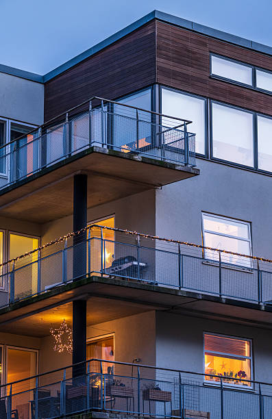 istock modern apartment balconies at dusk.. 2207594773