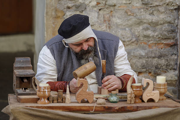Taggia, Italy - February 25, 2024: Participants of historical reenactment in the old town of Taggia, in Liguria region of Italy. The actors acting out episodes of daily life in settings that evoke moments of life lived fully the seventeenth century. The episodes depicted are inspired by true events, drawn from documents preserved in the Historical Archives