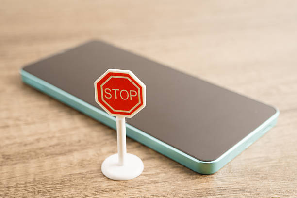 istock Sign stop, Do not use smartphone for safety and good health. 2207597607
