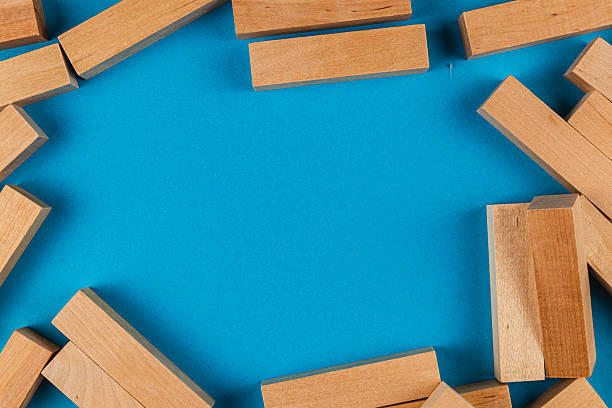 istock Wooden blocks arranged on a blue background for play 2207597796