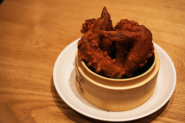 Fried chicken wings and crispy garlic in plate