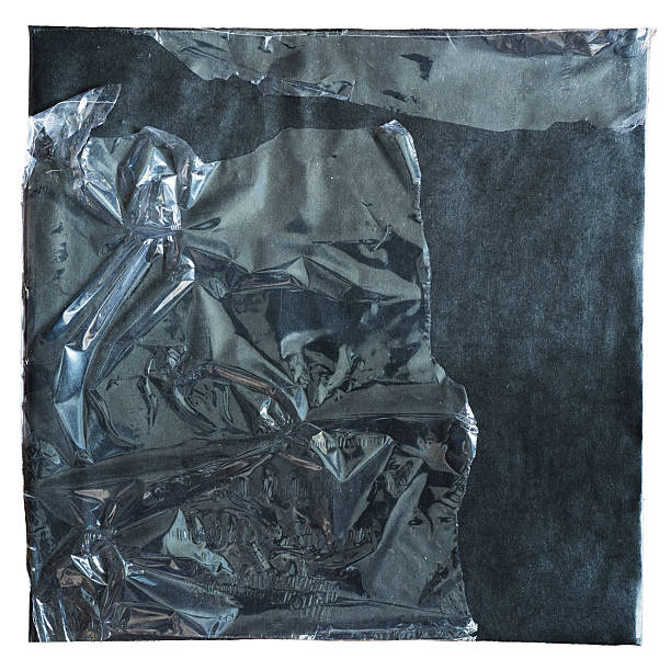istock Black paper vinyl album cover with peeled plastic wrap packaging 2207600174