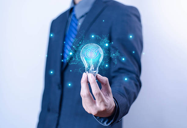 istock Innovation and inspiration concept. Businessman holding creative light bulb with industry and marketing development network icons. Strategic planning. Modern business and inspiration Idea innovation 2207601052