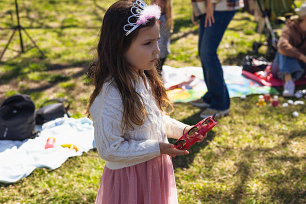 istock Children celebrate outdoors with musical instruments in a festive gathering at a park 2207601146