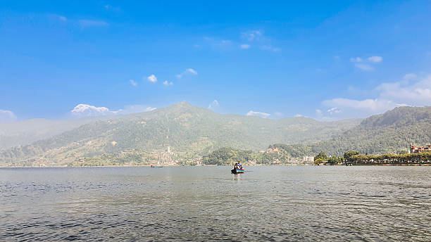 istock People in a boat on the lake. 2207601253