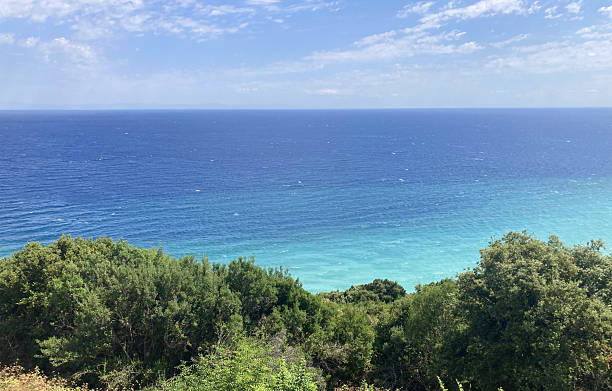 istock Mediterranean Caribbean Style Beach, Turquoise Sea, Forest, and Mountains 2207601309