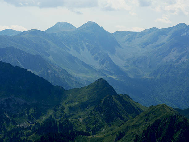 istock mountain landscape with dark green peaks and cloudy sky 2207602709