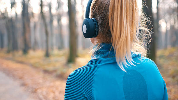 istock Young Woman Outdoors Mentally Preparing for a Jog in Forest 2207603154