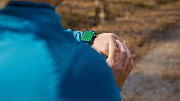 istock Woman Checking Smartwatch Display During Outdoor Workout in Natural Setting 2207603179