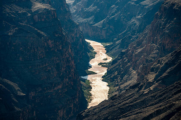 Grand Canyon sunset at Toroweap Lookout on the North Rim. This stunning overlook showcases dramatic cliffs, deep canyons, the Colorado River and golden light painting the rugged landscape, creating a mesmerizing natural wonder. Toroweap is a very remote location and very challenging to get to.