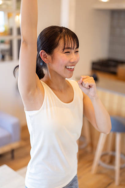istock Young female dancer dancing in living room - high angle view 2207606501