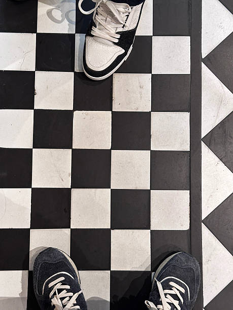 Stock photo showing close-up, elevated view of monochrome tiled flooring.