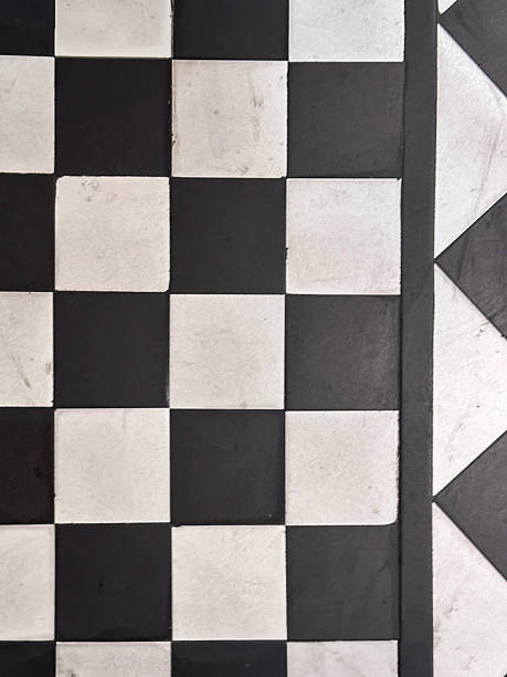 istock Full frame image of floor black and white checked tiles, monochrome chequerboard pattern, elevated view 2207607284