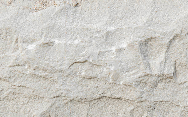istock [4k] Close-up of White Crushed Stone Texture 2207614389