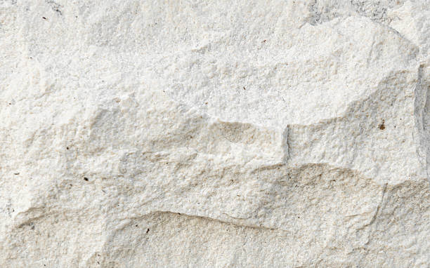 istock [4k] Close-up of White Crushed Stone Texture 2207614415
