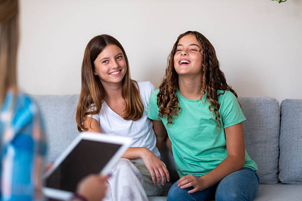 istock two girls at the psychologist's 2207614642