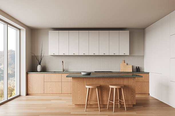 istock Modern minimalist kitchen with wooden cabinetry and white upper cabinets. 3D Rendering 2207615594