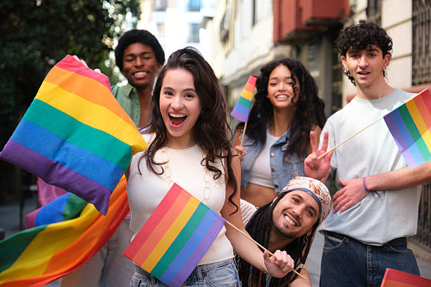 istock Group of friends having fun at a LGBT pride parade 2207618584