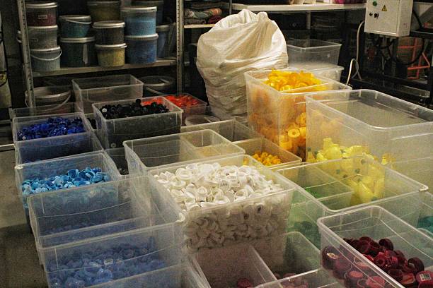 istock Sorted plastic bottle caps in clear containers. Collection of colorful container lids. Plastic caps organized in bins. Storage of various colored bottle tops. Boxes filled with plastic closures 2207620122