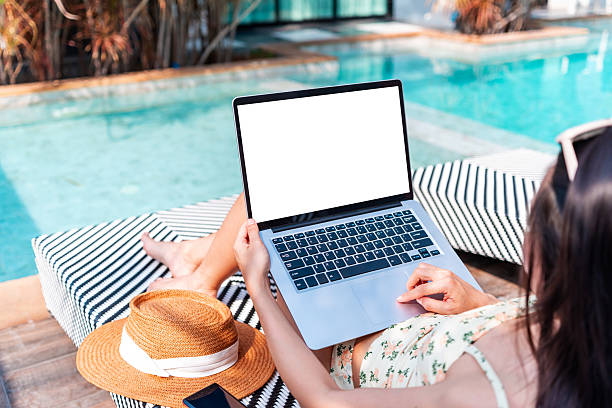 istock Young woman freelancer traveler working online using laptop while traveling for summer vacation, Workation and digital nomad concept 2207621238