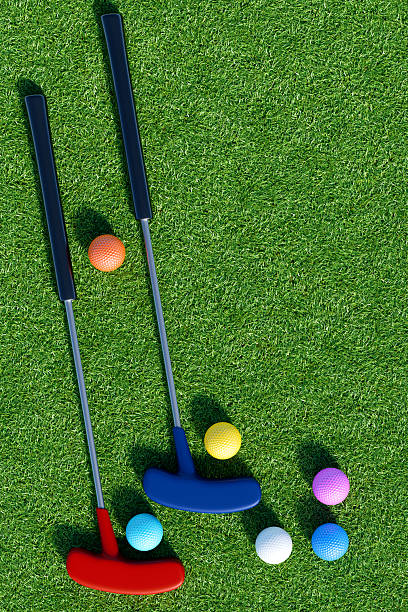 istock Mini golf clubs and colorful balls on grass.3d rendering 2207624182