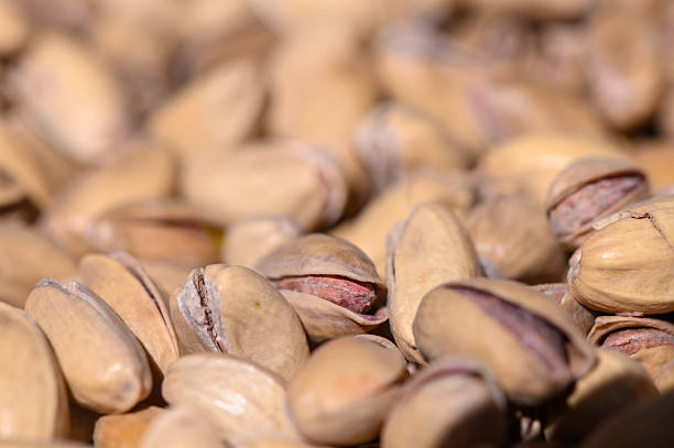 Closeup roasted and salted Pistachios, full frame horizontal composition