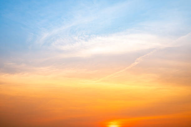 istock Beautiful , luxury soft gradient orange gold clouds and sunlight on the blue sky perfect for the background, take in evening,Twilight, Large size, high definition landscape photo 2207627351