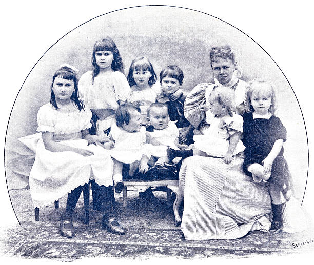istock Mother and 8 children sitting and standing ourdoors 2207629120