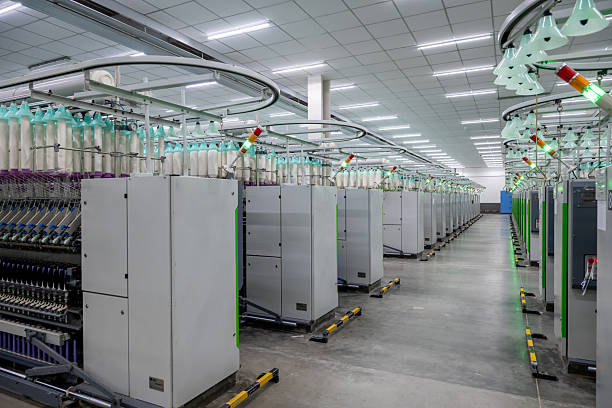 istock Modern workshop equipment in textile factory 2207629460