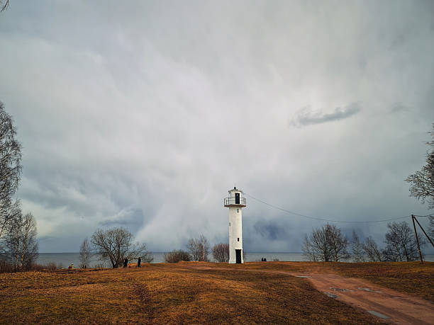 istock Landscape with white lighthouse near the lake 2207631051