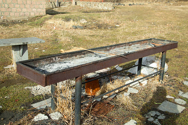 Dirty empty barbecue grill in outdoors.