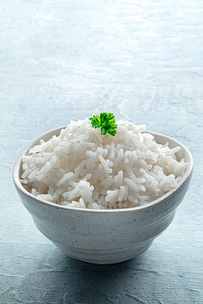 istock White rice, cooked. A bowl of boiled long grain rice, a simple side dish 2207636564