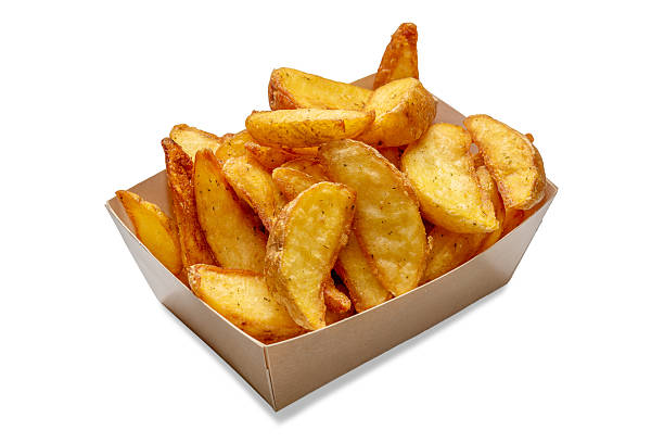 istock Fried potato wedges in cardboard take- away tray 2207638506