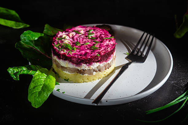 istock Salad with herring and beets in a plate. Salad Herring under a fur coat 2207639129