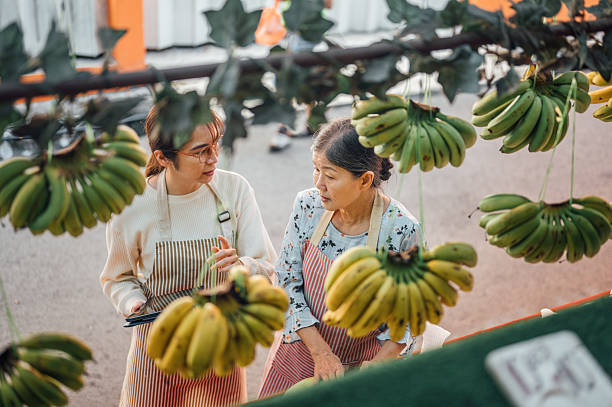 Tech-Savvy Entrepreneurs: Two Women Running a Fruit Stand with Digital Tools