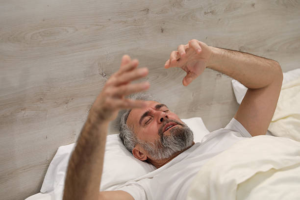 istock Middle-Aged Man Sleeping Peacefully in Bed – Morning Concept 2207641246
