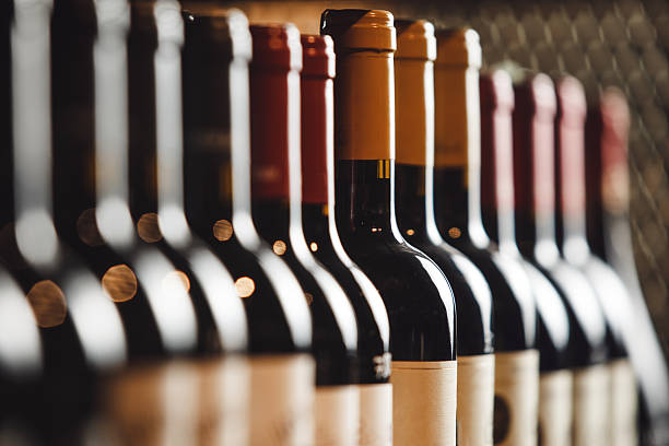 istock Wine cellar with elite drinks on shelves, close up 2207643498