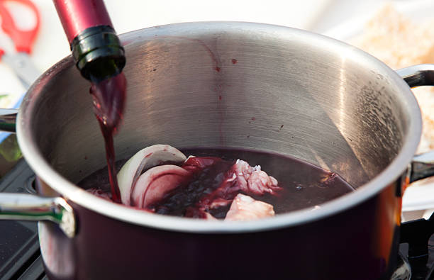 istock red wine and onion slices in the pot 2207643935