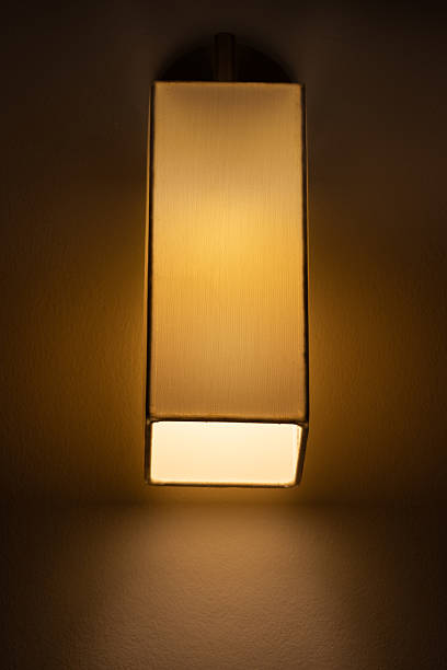 istock A textile lamp in the shape of a vertical block hangs on the wall 2207644551