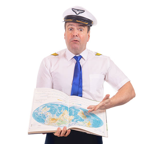 istock Shocked plane captain with open country atlas, isolated on white background. 2207644559