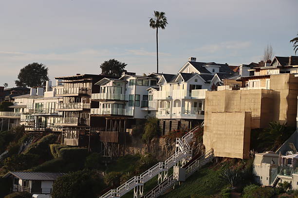istock Luxury Cliff side Homes Overlooking the Ocean at Sunset 2207646064