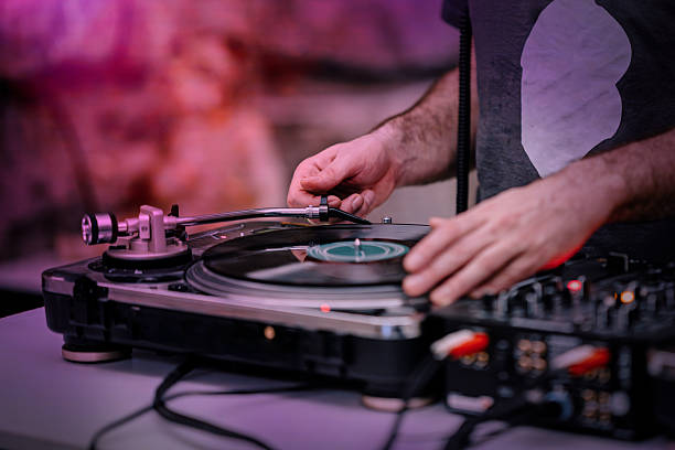 istock DJ in studio placing the needle on a vinyl record. 2207646657
